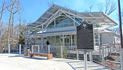 View of front building entrance, with historical marker sign (eastbound only)