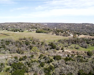 View from a look-out platform at Kerr County rest area towards valley below, Westbound