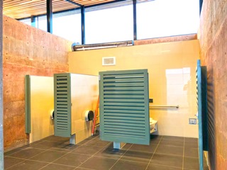 The restroom interior is filled with natural light
