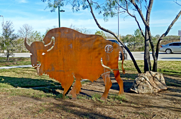 An outdoor sculpture depicts a buffalo once roamed the land