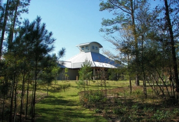 Another view of the facility through the pine trees