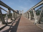 The metal truss suspension bridge