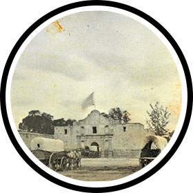 Covered wagons in front of the Alamo, 1868